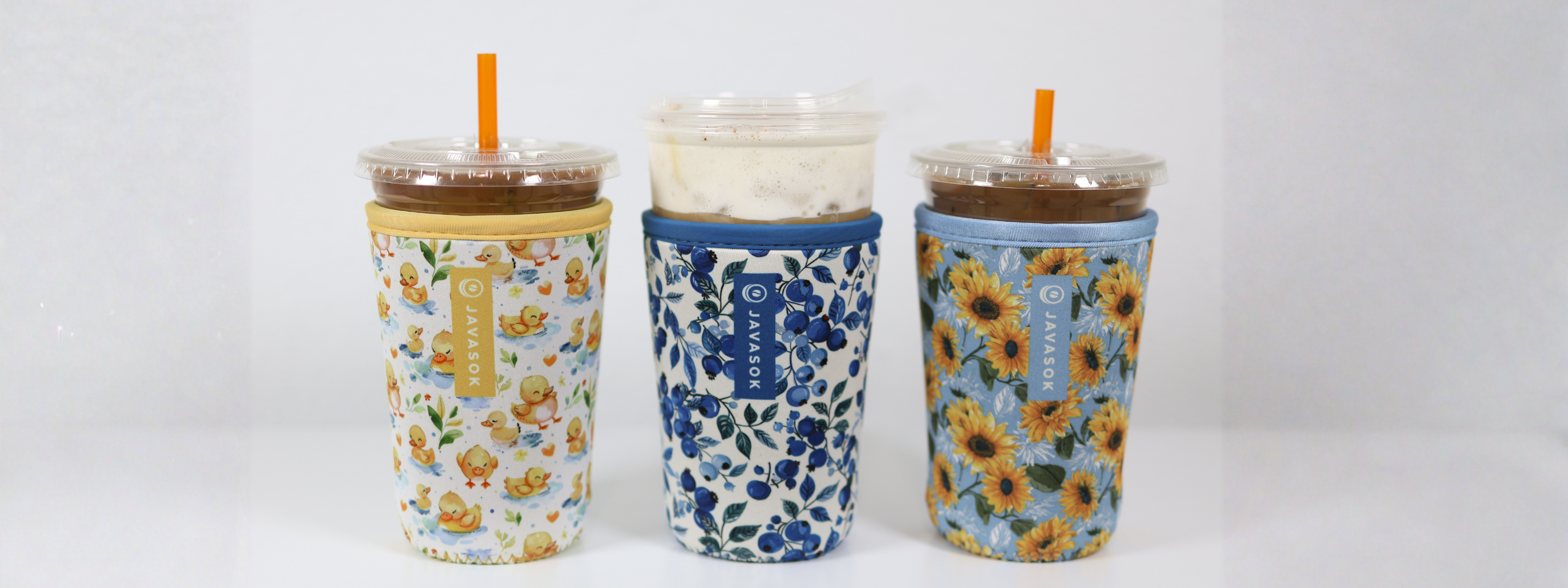 spring javasoks featuring a white and yellow duck print, a white and blue blueberry floral print, and a blue and yellow sunflower print